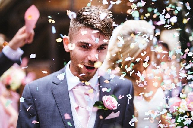 Confetti on bride and groom