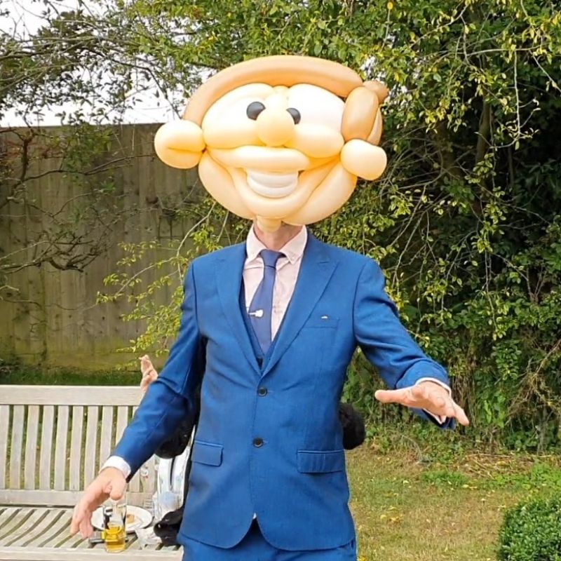 Balloon head mask at a wedding