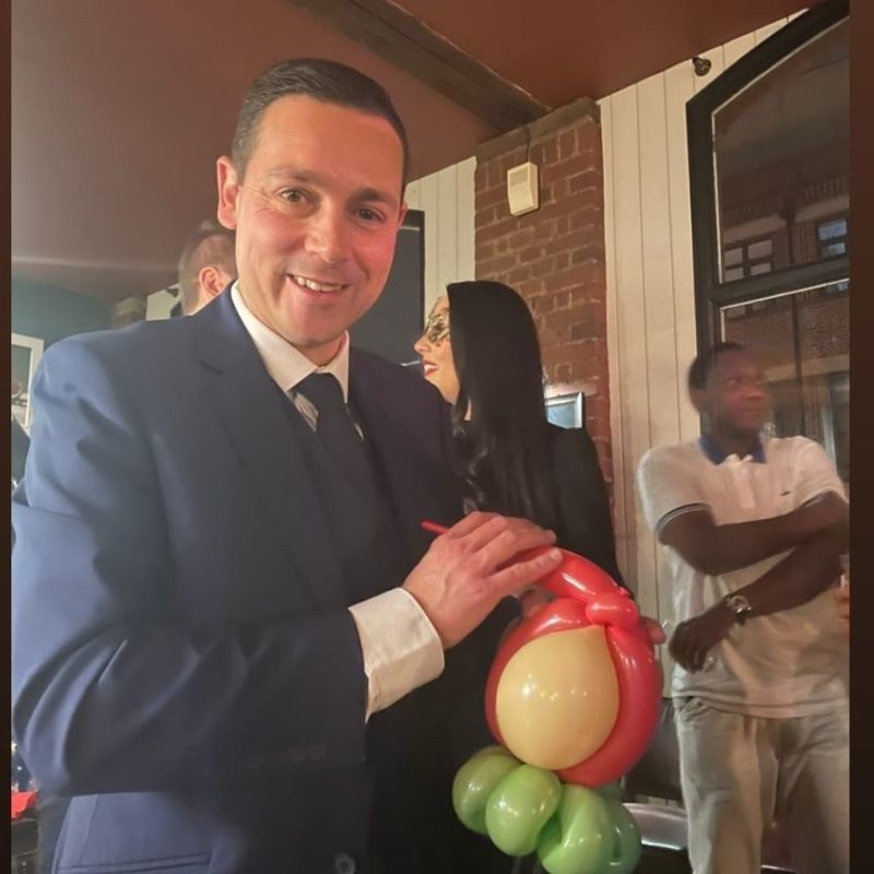 Twisting a balloon at a corporate party