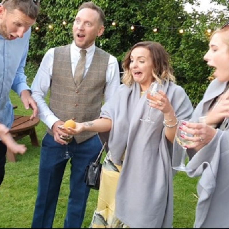 Amazed reaction at wedding magic trick